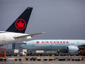 Air Canada planes are parked at Toronto Pearson Airport in Mississauga, April 28, 2021. REUTERS/Carlos Osorio/File Photo