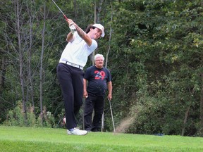 Forward Riley Brousseau tees off during the fifth-annual Timmins Rock NHL Celebrity Golf Tournament at the Hollinger Golf Club on Thursday. The tournament, back after a one-year absence due to COVID-19, attracted 100 golfers, the maximum allowed under current restrictions, with former NHL superstar Marcel Dionne — checking out Brousseau’s form — being the guest of honour. ANDREW AUTIO/THE DAILY PRESS