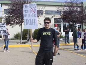 An anti-masking protest assembled outside of the Elk Island Public Schools division building on Thursday, August 26. Travis Dosser / Postmedia