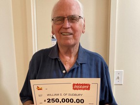 Tom Sutton of Sudbury celebrates his Instant Red Hot lottery win.