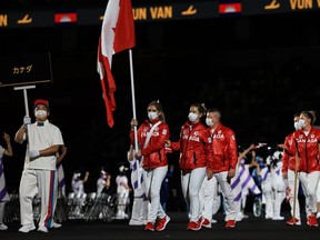 Flag bearer Priscilla Gagne of Sarnia, Ont., leads the Team Canada delegation in the parade of athletes during the opening ceremony of the Tokyo Paralympic Games at the Olympic Stadium on August 24, 2021, in Tokyo, Japan. (Photo by Buda Mendes/Getty Images)