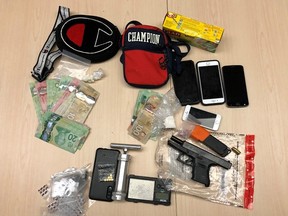 Kingston Police found fentanyl, cocaine, crystal methamphetamine, cash and a pistol during a search of a house on Barrie Street Friday. Three people, including a local woman, are now facing charges.