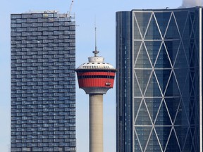 The Telus Sky building, left, appeared to have topped out at its 60 floor height as it rose behind the Calgary Tower and next to The Bow building in Calgary on Tuesday, February 25, 2020. The tower will have new ownership under a $1.67-billion deal announced Tuesday.