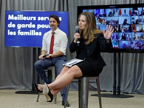 Finance Minister Chrystia Freeland, along with Prime Minister Justin Trudeau, talks to families virtually in Ottawa April 21, 2021.