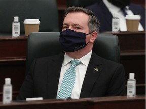 Jason Kenney sports a mask in the Alberta Legislature. Postmedia filephoto.