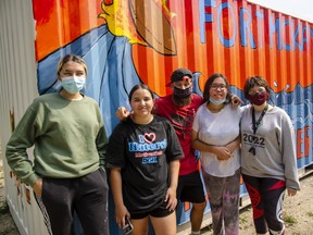 L-R: Brace Grandjambe, Alicia Gladue, Dylan Elias, Harmony Orr and Richelle Stewart at the Fort McKay First Nation youth centre's sea-can mural project on August 3, 2021. Scott McLean/Fort McMurray Today/Postmedia Network