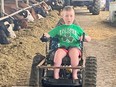 John Ray, 12, who lives with muscular dystrophy, has found independence on the farm thanks to a new track chair