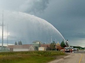 The City of Grande Prairie Fire Department practices shooting water from a ladder at its Eagar Station along Resources Road in Grande Prairie on Thursday, July 9, 2020.