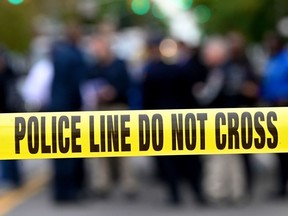 Police tape secures a crime scene outside a club after a shooting in Brooklyn on October 12, 2019.