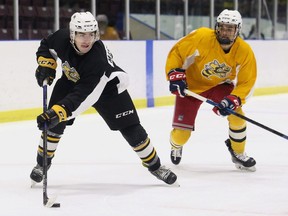 Angus MacDonell, left, is chased by Ethan Boye during a scrimmage at the Sarnia Sting's orientation camp at Progressive Auto Sales Arena in Sarnia, Ont., on Monday, Aug. 30, 2021. Mark Malone/Chatham Daily News/Postmedia Network