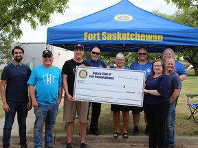 The Fort Saskatchewan Rotary Club present a $5000 donation to Sleep in Heavenly Peace. The donation will be invested into providing beds for the community. Photo by James Bonnell.