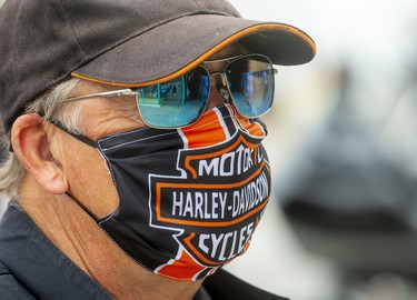 Dennis Anilowski of Stoney Creek, gets his cake and eats it too, wearing a Harley-Davidson MotorCycles mask to the Friday the 13 biker gathering in Port Dover. 

(Mike Hensen/Postmedia Network)