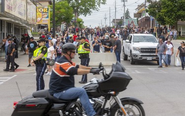 OPP officers direct traffic in Port Dover on the Friday the 13th biker rendezvous in the small port town.

Sgt. Ed Sanchuk, of the OPP gave an estimate of 30-35,000 attendance down from pre-COVID meetups of over 100,000 in the town.

(Mike Hensen/Postmedia Network)