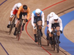 Canada’s Nick Wammes, centre, competes in a men’s keirin repechage heat at the Izu Velodrome in Shizuoka, Japan, during the Tokyo Olympics on Aug. 7, 2021.  (REUTERS/Matthew Childs)