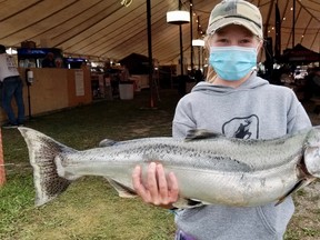 Olivia Widdes, 12, of Walkerton, with her 9.86-pound Chinook salmon she caught Tuesday, Aug. 31, 2021 during the Owen Sound Salmon Spectacular Fishing Derby in Owen Sound, Ont. (Scott Dunn/The Sun Times/Postmedia Network)
