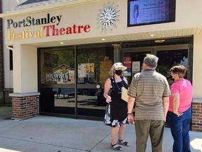 A theatre volunteer greets guests outside the Port Stanley Festival Theatre, which recently opened for its 2021 summer/fall season. Photo by Sharon Grose Photography.