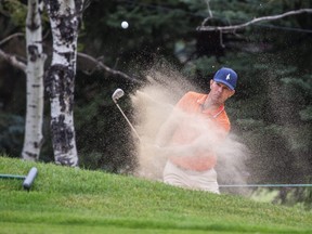 Canadian golfer Mike Weir hits balls out of a sand trap while practising during the ProAm Day at the Shaw Charity Classic in Calgary, Alberta, on August 11, 2021. Todd Korol/Shaw Charity Classic