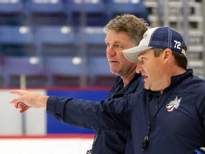 Sudbury Wolves head coach Craig Duncanson, left, listens to associate coach Darryl Moxam during a practice on the opening day of rookie orientation camp at Sudbury Community Arena in Sudbury, Ontario on Monday, August 30, 2021.