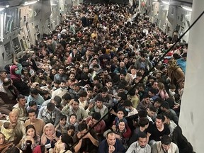 This image distributed by the US Air Force shows the inside of Reach 871, a U.S. Air Force C-17 Globemaster III flown from Kabul to Qatar on August 15, 2021. The plane evacuated some 640 Afghans from Kabul.