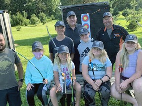 The Mitchell Fish & Game Club received a donation of a youth archery set from Jason Beuermann (front row, left), of Coonhound Sales & Marketing in Dublin Aug. 19. On hand to receive the donation were Natalie Weernink (front row, second from left), 10; Phoebe Wood, 9; Alexis Dusky, 9; Kayleigh Dusky, 11 and Charlie Wood, 16. Back row (left): Payton Wood, 14; archery instructor Bob Ten Hove, Thomas Weernink, 11 and Scott Wood, fish & game club president. ANDY BADER/MITCHELL ADVOCATE