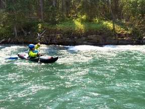 Andrea Wojcik, who lives with a T-2 level spinal cord injury, achieves her dream and kayaks the lower Kananaskis River rapids in a first-ever white-water kayaking venture on July 25. Photo credit to Connie Dw.