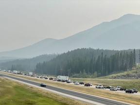 Traffic backed up before Deadman's Flat exit in the eastbound lane of the TransCanada on Saturday, August 14, as firefighters continue to work on the blaze. Photo Marie Conboy/ Postmedia.