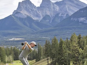 Head Golf Professional Chris Cooke hits a long drive into the Three Sisters Mountains off the second tee at the Silvertip Resort on Saturday, August 28, 2021. photo by Pam Doyle/www.pamdoylephoto.com