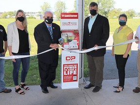 Quinte West installed a SaveStation public access defibrillator in Centennial Park thanks to a $10,000 grant from Canadian Pacific Railway. Joining Mayor Jim Harrison for the ribbon cutting ceremony were, from the left: Keeley Biron, Quinte West parks and open space supervisor, Katrysha Gellis, SaveStation Ambassador, Mayor Jim Harrison, Brandon Billingsley, CP Rail superintendent operations, Corin Vail, Action First Aid, and Richard Anderson, Quinte West health, safety and employee services officer. HANNAH BROWN PHOTO