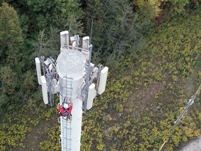 A worker climbs a Rogers Communications tower. The company's expansion of its 5G mobile service now includes Pembroke and Petawawa. Rogers Communications