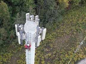 A worker climbs a Rogers Communications tower. The company's expansion of its 5G mobile service now includes Oliphant and Wiarton. Rogers Communications photo.