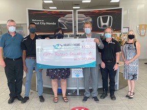 Hospice Quinte Executive Director, Jennifer May-Anderson and West City Honda President, Greg Sudds are joined by West City Honda staff in celebration of a $50,000 contribution to the Heart & Home Building Campaign. SUBMITTED PHOTO