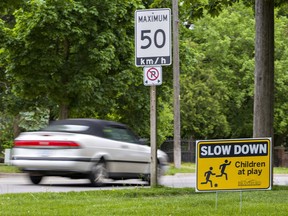 Lawn signs telling drivers to slow down have been distributed to residents in an effort to reduce speeding on city streets.