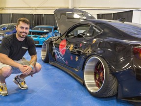 Nick Green of Ridgeville, Ontario shows off his 2014 Scion FRS at the Summer Showdown car show on Saturday at the Norfolk County Fairgrounds in Simcoe.