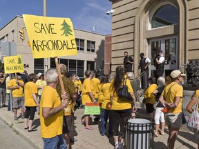 Friends of Arrowdale supporters gather outside Brantford's new city hall, which opened to the public Monday morning. Many were upset they were not allowed inside. Security guards told them entry was allowed only to those on city business or who were paying a bill.