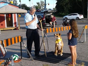 Brian Hinkley, chair of the Dogford Park Neighborhood Association speaks during a fundraising event at the Dairy Queen at King George and Toll Gate Roads in Brantford. SUBMITTED PHOTO