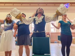 Zora Catone (centre, as Lumiere) and ensemble members (from left) Joseph A Sebok, Destiny Gull, Richard V. Ouellette,  Alissa Cooper, Scott Mountain rehearse a number from Playful Fox Productions presentation of Beauty and Beast: The Broadway Musical.
