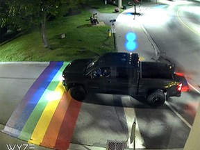 Gananoque police released this still from a video as they sought a suspect in the latest defacing of the town's Pride crosswalk. A 21-year-old man has since been charged. (SUBMITTED PHOTO)