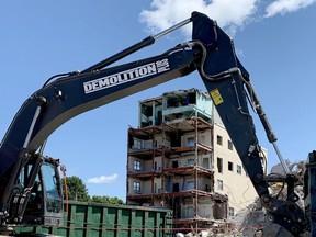 Demolition equipment sits idle on Civic Holiday Monday near what is left of the former St. Vincent de Paul Hospital. (RONALD ZAJAC/The Recorder and Times)