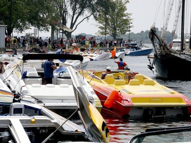 As spectators gather for the 1000 Islands Poker Run on Blockhouse Island Saturday, an orange flag warns speedboaters to prepare to launch. (RONALD ZAJAC/The Recorder and Times)
