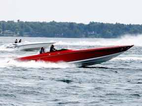 Participants in the 1000 Islands Poker Run ride the waves as they head west toward Gananoque after a stop in Brockville on Saturday afternoon. (RONALD ZAJAC/The Recorder and Times)