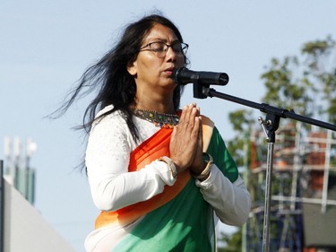 Priti Luhadia recites a prayer before the raising of the Indian flag behind City Hall on Sunday morning, the 75th anniversary of India's independence. (RONALD ZAJAC/The Recorder and Times)