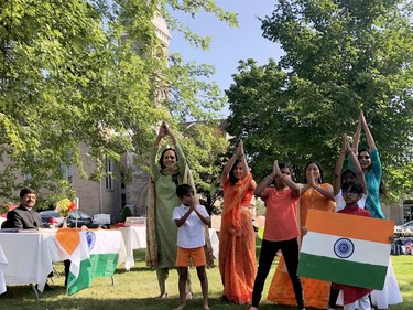 Members of Brockville's Indo-Canadian community perform a dance while Vinod Sagar, left, of the Indian High Commission in Canada, looks on during an event celebrating India's Independence Day on the Court House Green Sunday morning. (RONALD ZAJAC/The Recorder and Times)