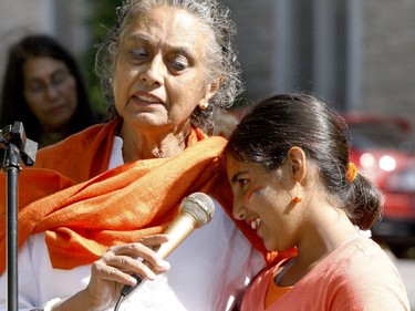 At an event celebrating India's Independence Day on Brockville's Court House Green Sunday morning, Nilu Bhatt tried to coax her granddaughter, Nalina Bhatt, to join her in singing a prayer. (RONALD ZAJAC/The Recorder and Times)