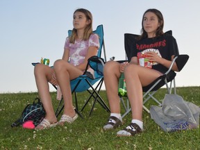 BACK ROW AND THEN SOME
Kaitlin and Ava Geraghty sit back near the top of Laurier Hill and prepare to enjoy the Brockville Soccer Club's movie night on Saturday. The event for players and their families was sponsored by the Brockville Police Service.
Tim Ruhnke/The Recorder and Times