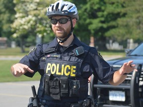 Constable Dave Holmes of the Grenville County OPP detachment  interacts with youngsters during a bicycle safety presentation in Maitland on Aug. 25.
Tim Ruhnke/The Recorder and Times