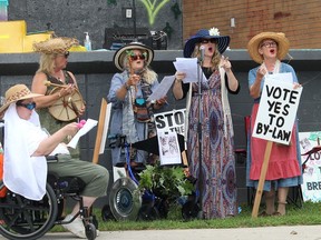 The Ragging Grannies sing a song - to the tune of the Beatles hit Hey Jude - calling on Chatham-Kent council to pass a tree cutting bylaw, during a rally the group organizedat Tecumseh Park in Chatham on Aug. 22. Ellwood Shreve/Postmedia Network