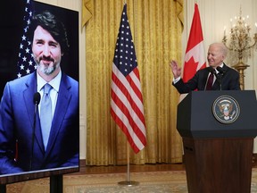 FILE PHOTO: U.S. President Joe Biden gestures to Canada's Prime Minister Justin Trudeau, appearing via video conference call, during closing remarks at the end of their virtual bilateral meeting from the White House in Washington, U.S. February 23, 2021. REUTERS/Jonathan Ernst