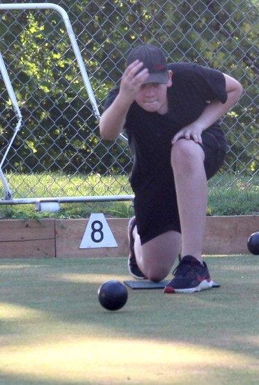 Peter Lindsay, 13, of Guelph, joined his grandfather Pete Cadotte, for a game at the Chatham Lawn Bowling Club in Chatham on Wednesday. Ellwood Shreve/Chatham Daily News/Postmedia Network