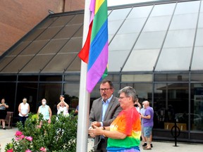 C K Pride president Marianne Willson said the flag raising at the Civic Centre in Chatham on Monday marked the 20th year the rainbow flag has flown at city hall to mark the kick-off of Gay Pride Week. Willson was joined by Mayor Darrin Canniff in raising the flag. Ellwood Shreve/Chatham Daily News/Postmedia Network