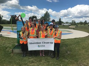 A group of volunteers pose for a photo at the Bonnyville Splash Park at Jessie Lake after cleaning up the shoreline. LICA and the FCSS are looking for volunteers to help cleanup Sandy Beach in Cold Lake this Friday. PHOTO BY LICA/FACEBOOK